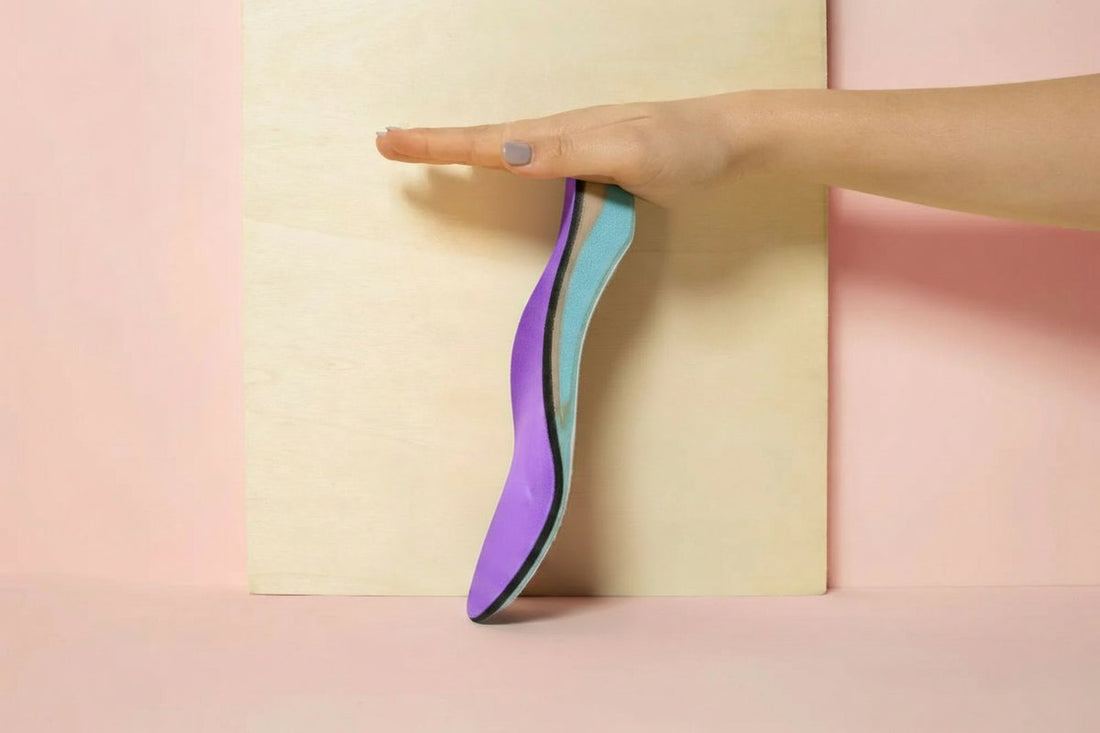 CustomTread orthotic insoles positioned next to running shoes on a clean surface, best running shoe insoles