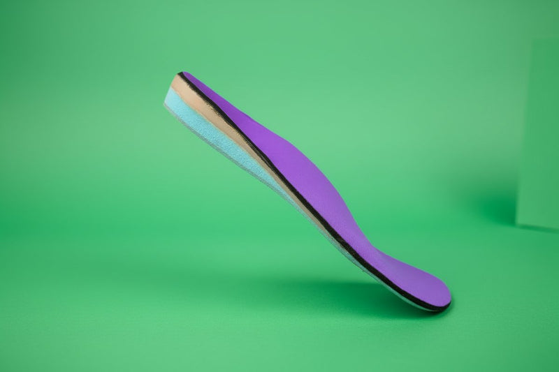 CustomTread orthotic insoles alongside wide toe box footwear demonstrating improved fit and accommodation for custom insoles