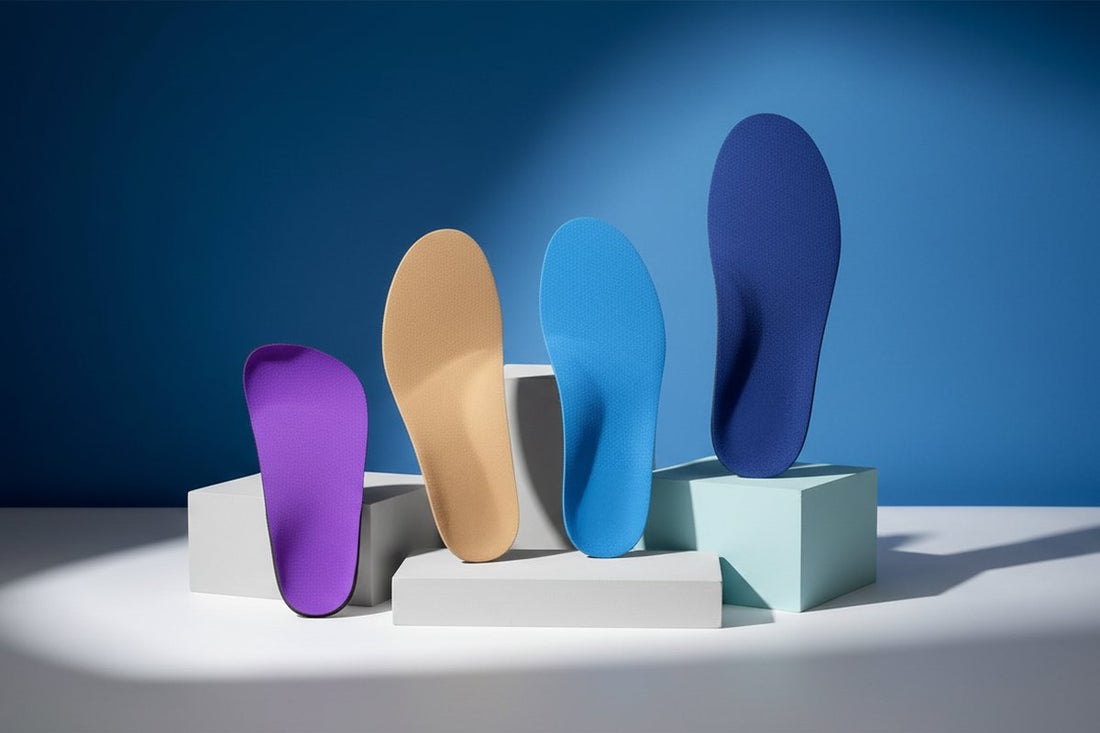 four CustomTread orthotic insoles in purple, beige, blue, and navy arranged on white pedestals against blue background
